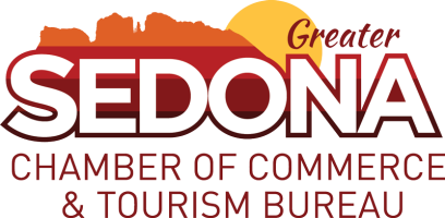 Logo of Greater Sedona Chamber of Commerce & Tourism Bureau with a sun and mountain.